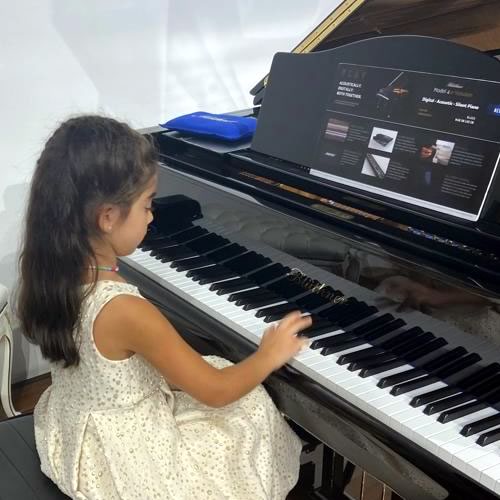 Girl attending piano class