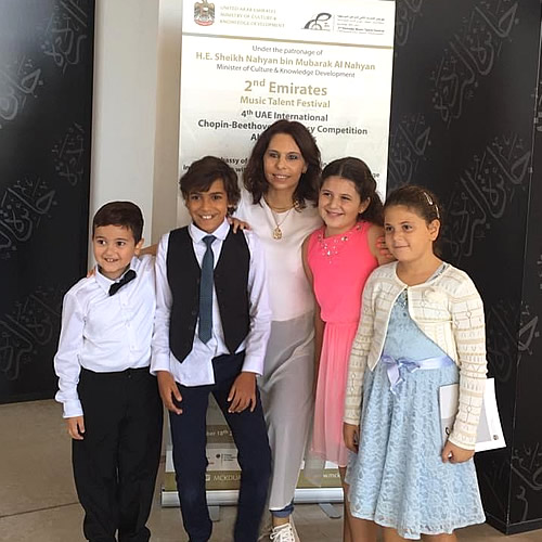 Piano teacher Marina Zamfir with her students